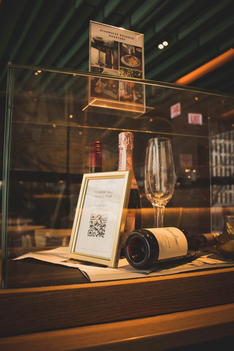 wine bottle beside wine glass on table